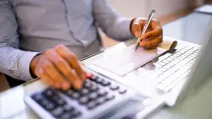 A man calculating expenses.